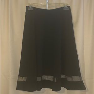 Skirt with lace strip towards the bottom